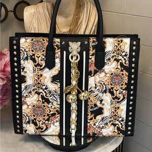 Like new Aldo Panther Black and Gold Baroque Print Tote Bag with Cherry 🍒 Charm